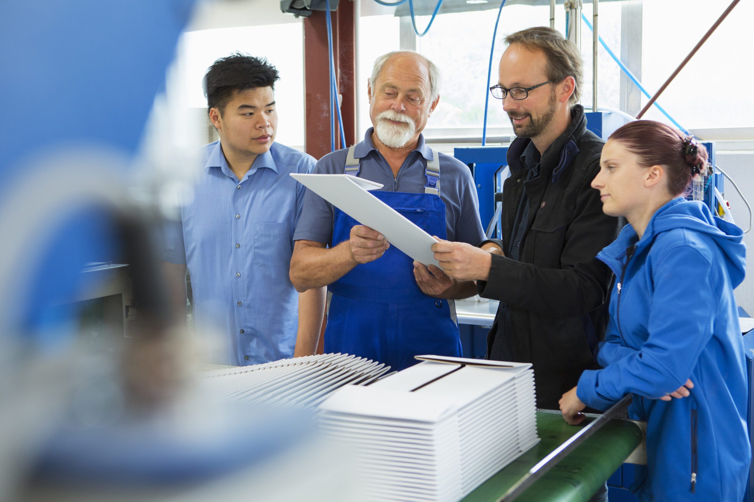 Factory workers with supervisor