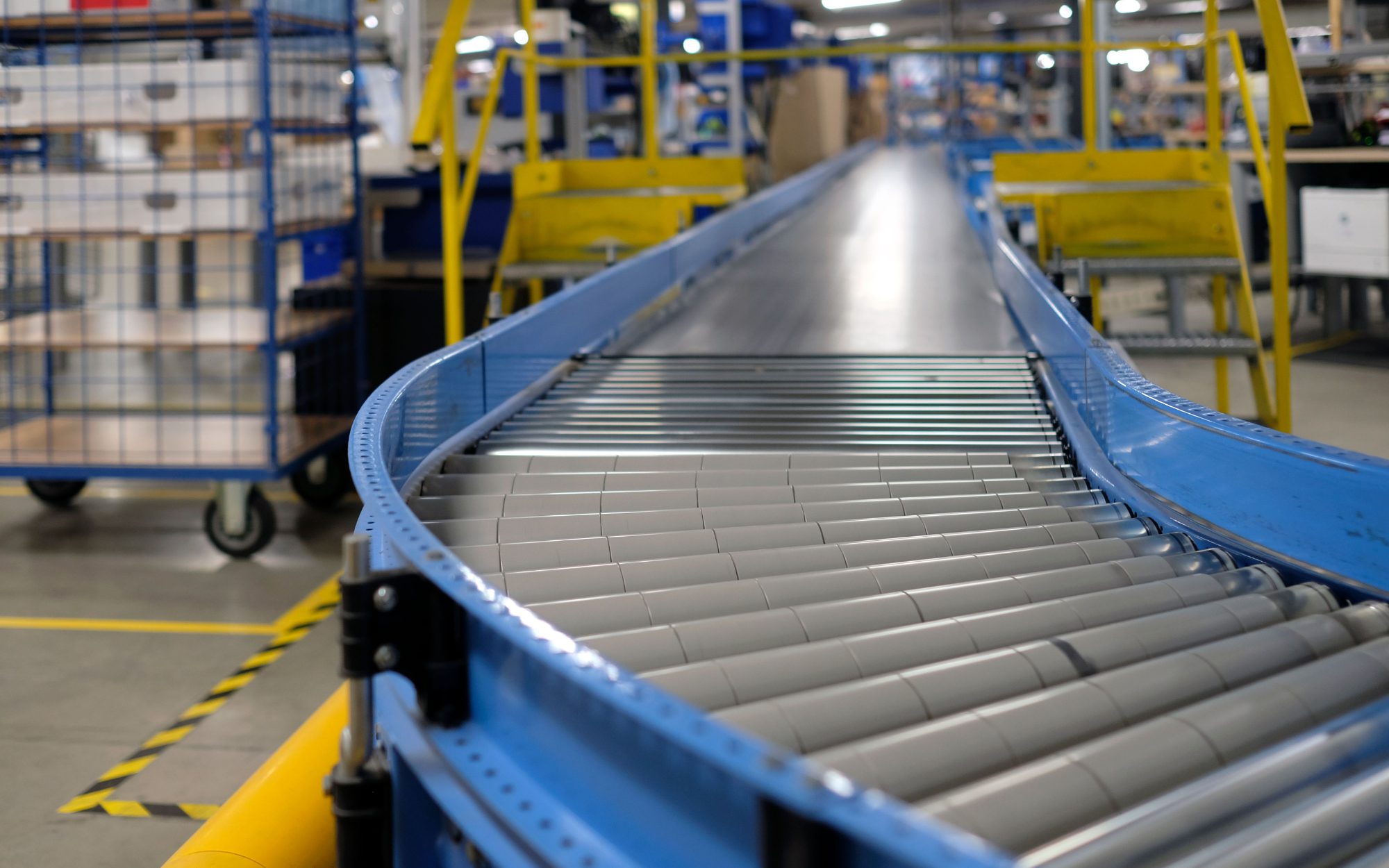 Manufacturing workers operating production line efficiently in industrial facility